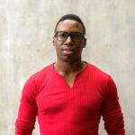 portrait of young handsome african man with eyeglasses